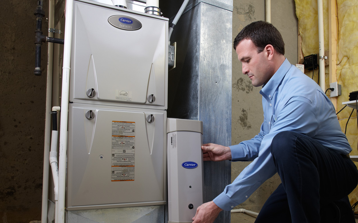 technician installing furnace 